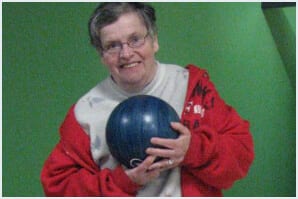 happy lady holding bowling ball